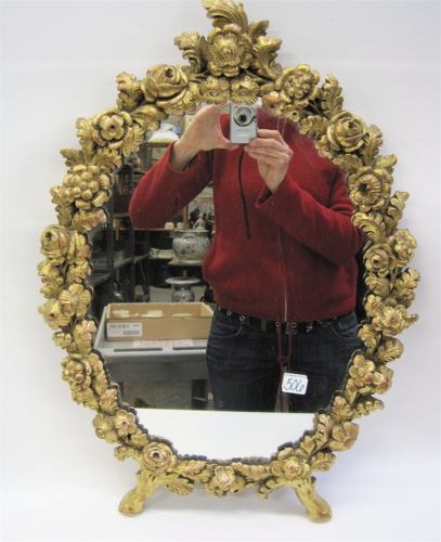 Appraisal: ITALIAN CARVED GILT WOOD MIRROR relief floral border with two