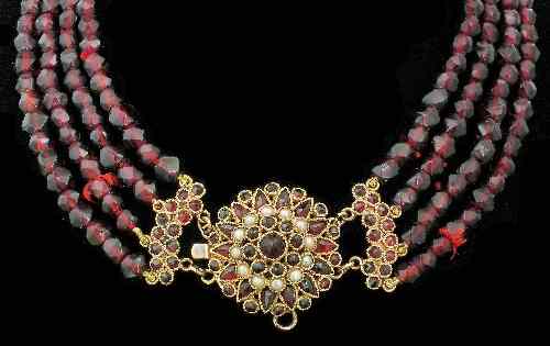 Appraisal: A Victorian garnet four strand necklace the faceted beads mm