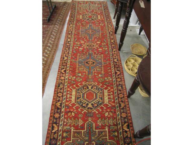 Appraisal: Heriz Persian Handmade Runner six geometric medallions on red field