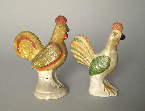 Appraisal: Two chalkware roosters th c retaining their original polychrome painted