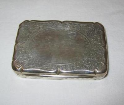 Appraisal: A VICTORIAN SNUFF BOX of moulded edged rounded oblong form