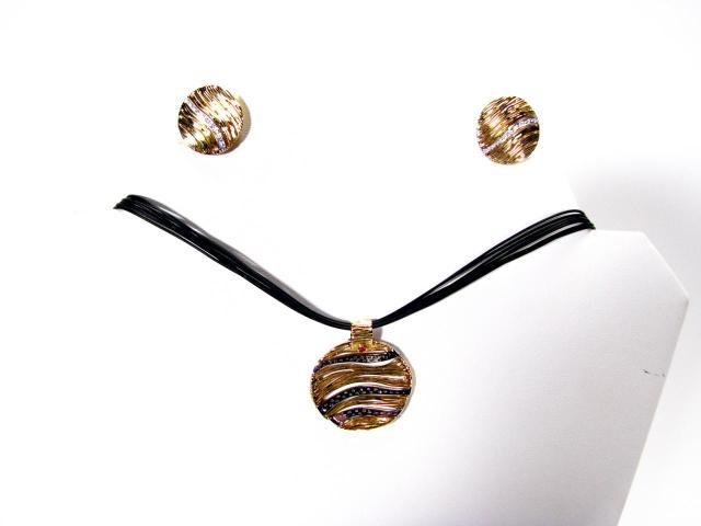 Appraisal: Roberto Coin designer k yellow and white gold pendant and