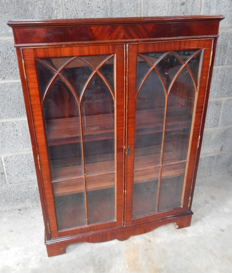 Appraisal: A thC flame mahogany finish free standing bookcase with a