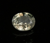 Appraisal: An Unusual Topaz-Colored Sapphire An unset oval-cut sapphire in an