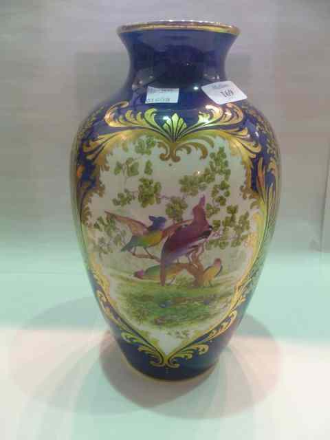 Appraisal: A SCALE BLUE WORCESTER STYLE VASE decorated oriental birds marked