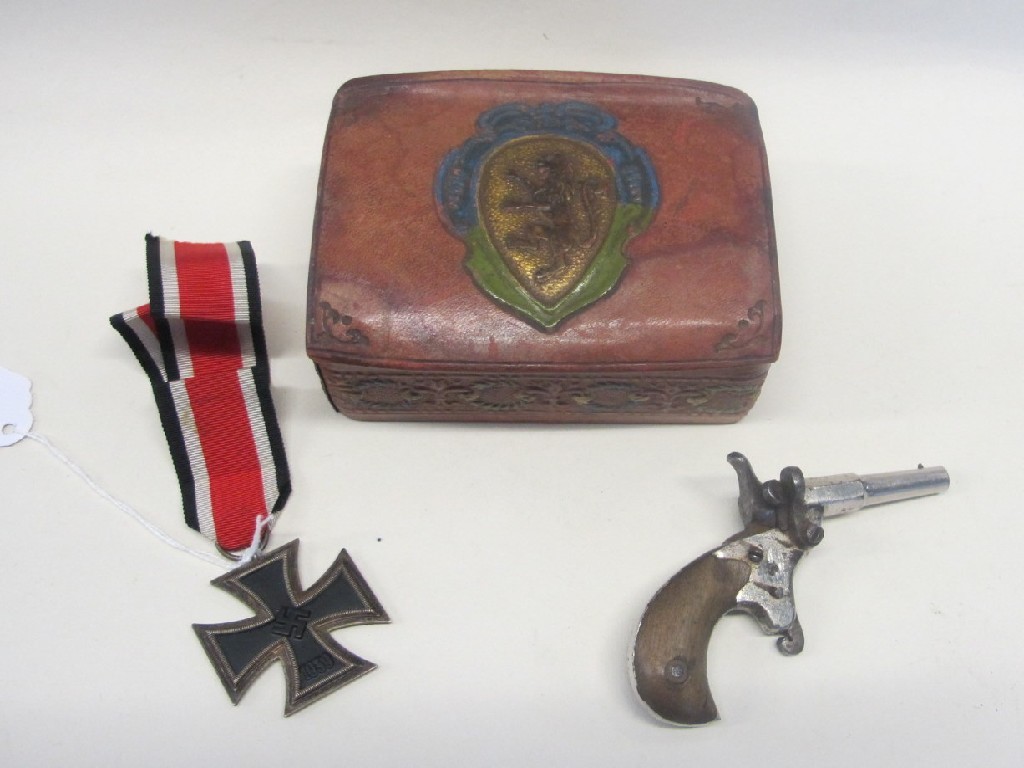 Appraisal: A German Iron Cross and a miniature steel pistol