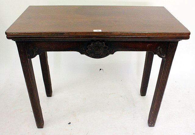 Appraisal: AN ANTIQUE MAHOGANY FOLD OVER TEA TABLE with reeded legs