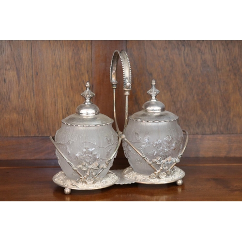 Appraisal: Condiment stand of two lidded glass jars on plated stand