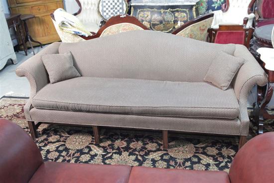 Appraisal: SOFA Camel back Chippendale style sofa with reeded legs and