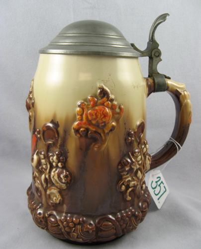 Appraisal: A GERMAN GLAZED POTTERY BEER STEIN L size The stein