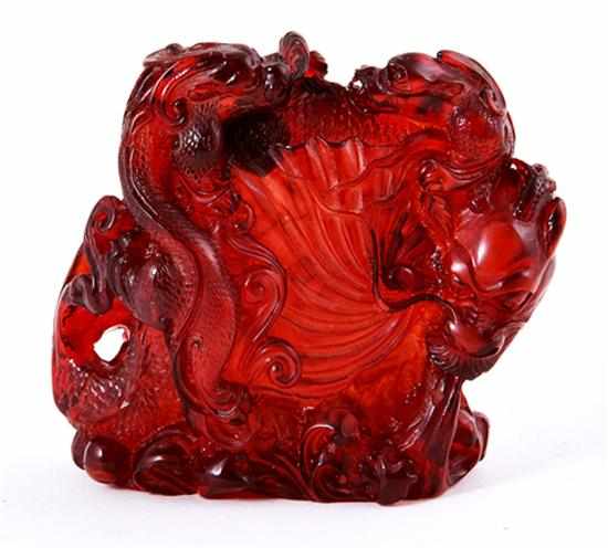 Appraisal: Japanese carved amber dragon figural group th century dragon-entwined shell