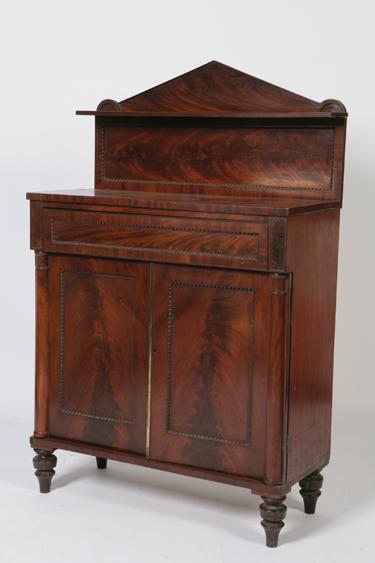 Appraisal: A REGENCY MAHOGANY CHIFFONIER with a triangular pediment above a