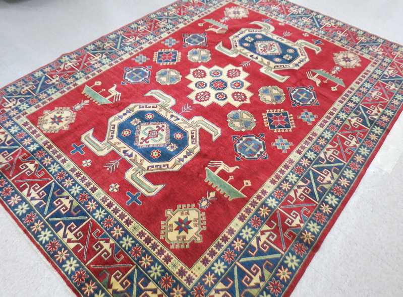 Appraisal: HAND KNOTTED ORIENTAL CARPET Pakistani Caucasian overall geometric pattern on