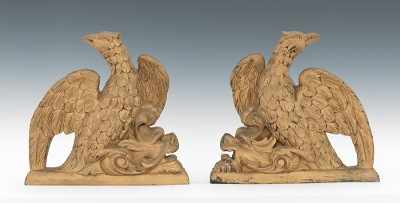 Appraisal: A Pair of Carved Wood Eagle and Dolphin Ornaments Pair