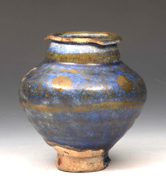 Appraisal: A SMALL BLUE GLAZED EARTHEN WARE JAR with gold lustre