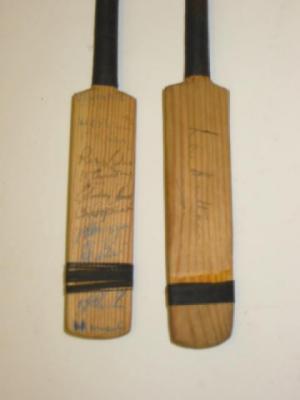 Appraisal: Two pine miniature cricket bats one signed by Len Hutton