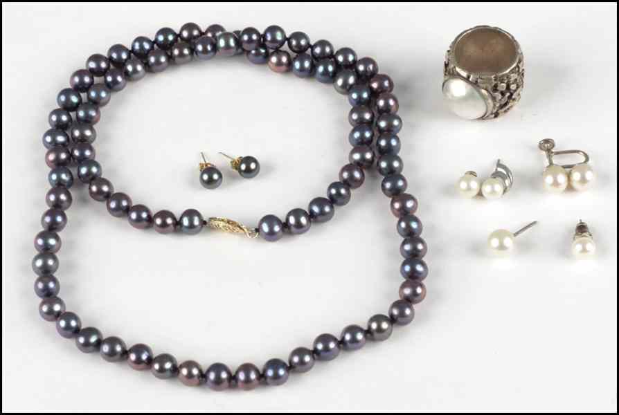 Appraisal: SINGLE STRAND BLACK PEARL NECKLACE Together with a pearl ring