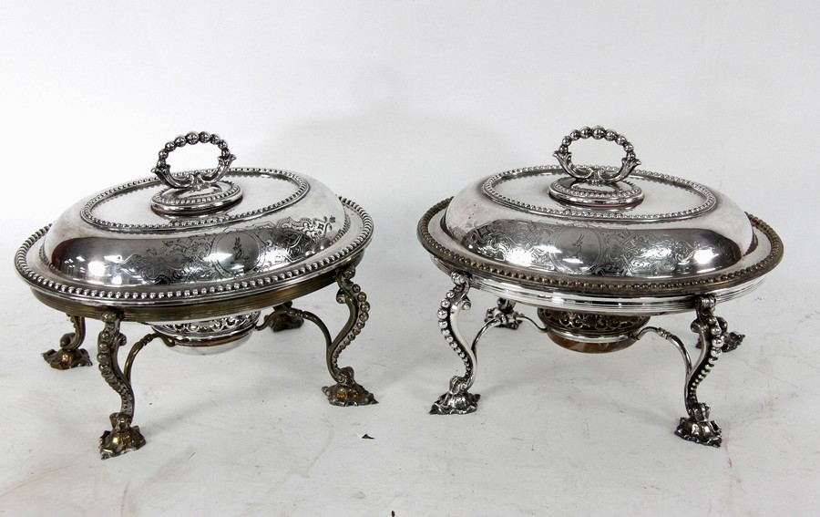 Appraisal: A pair of silver plated warming dishes the oval dishes