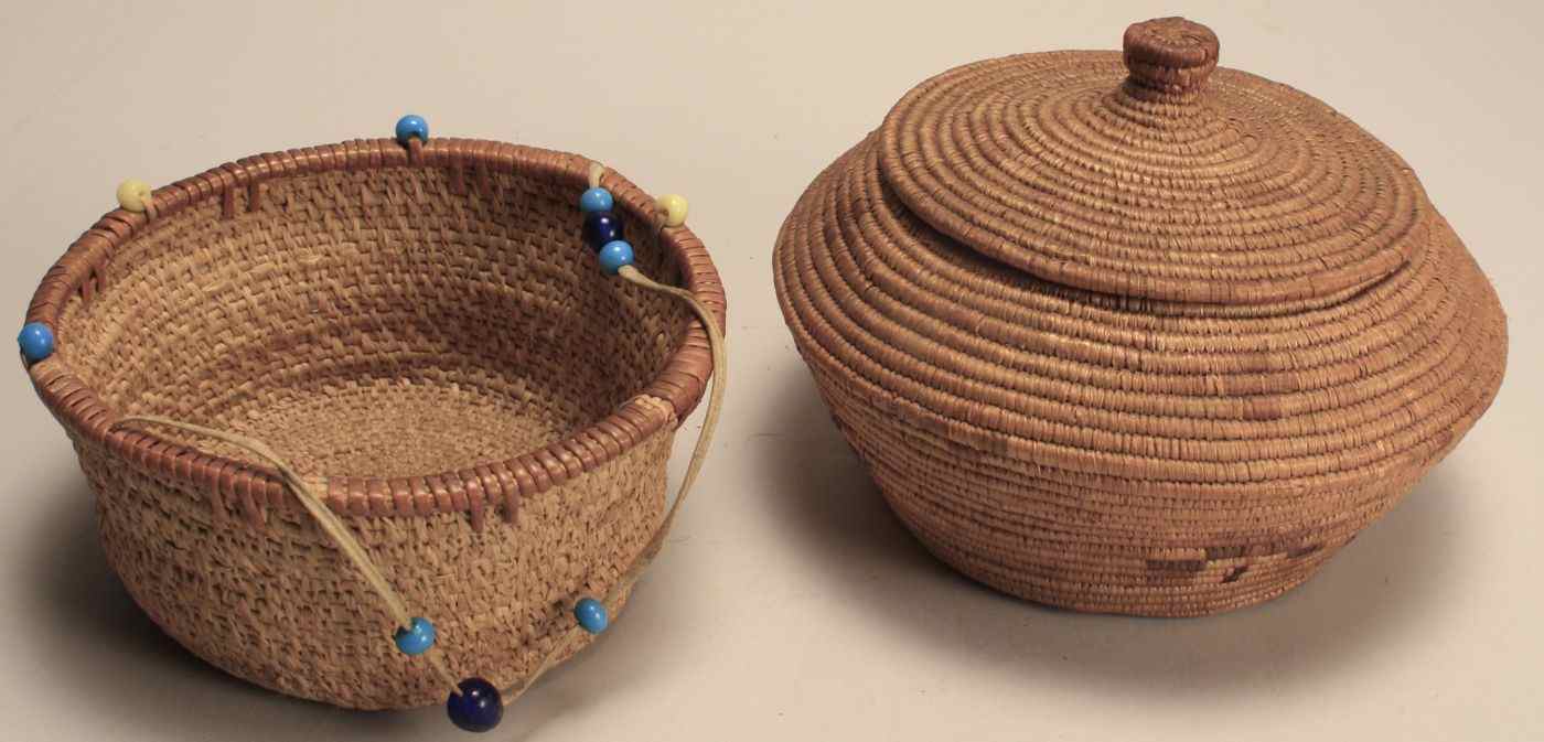 Appraisal: TWO AMERICAN INDIAN RAFFIA BASKETS th CenturyOne in ovoid form