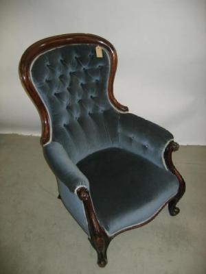 Appraisal: A VICTORIAN WALNUT FRAMED ARM CHAIR of spoon back form