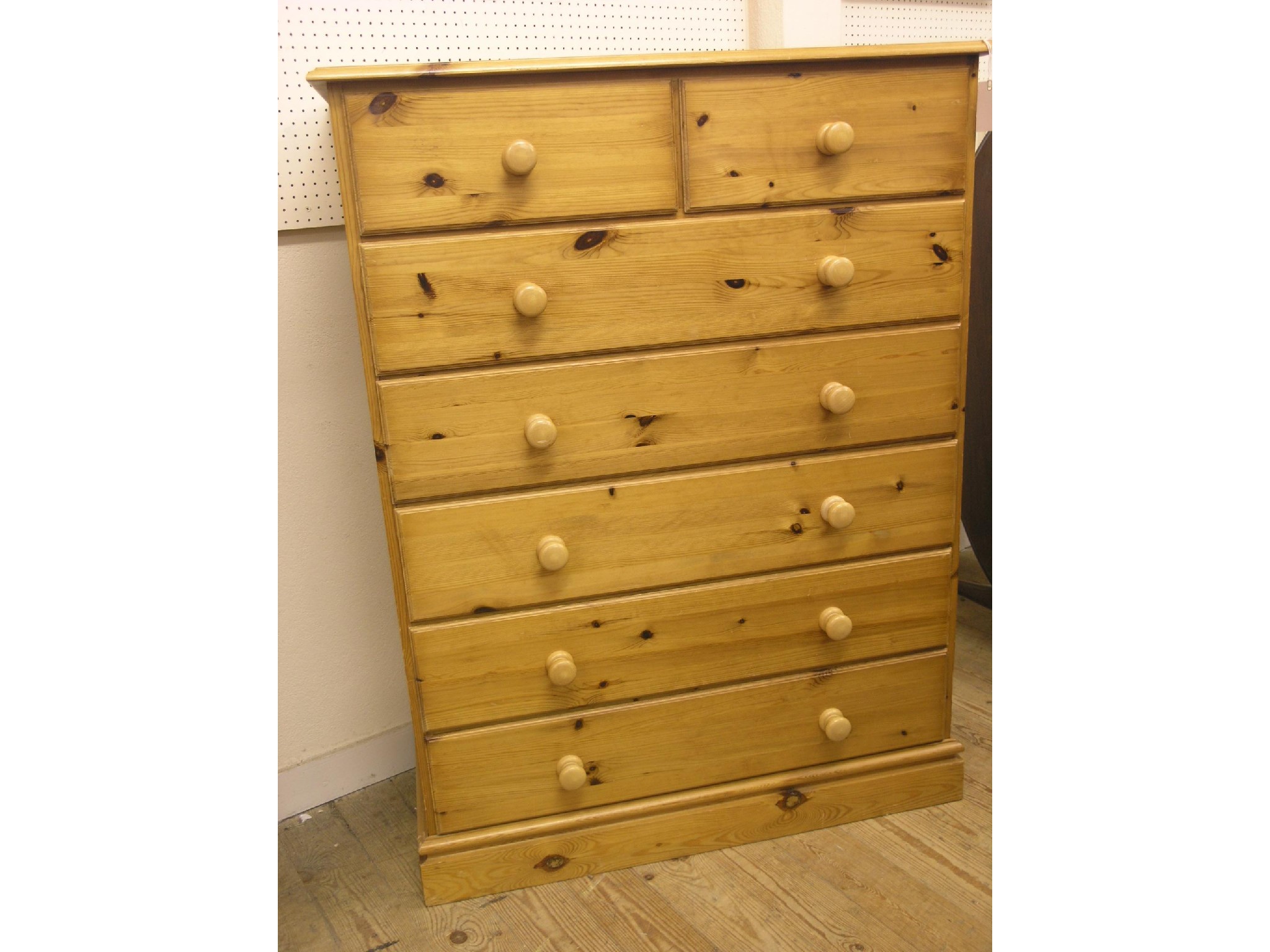 Appraisal: A waxed pine bedroom chest two short and five long