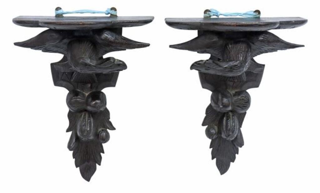 Appraisal: pair Black Forest carved oak mounted wall brackets having shaped