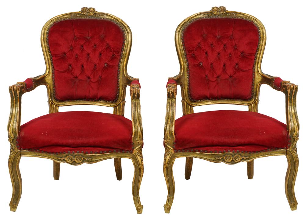 Appraisal: PAIR OF CONTINENTAL CARVED GILTWOOD ARMCHAIRSwith red velvet upholstery Condition