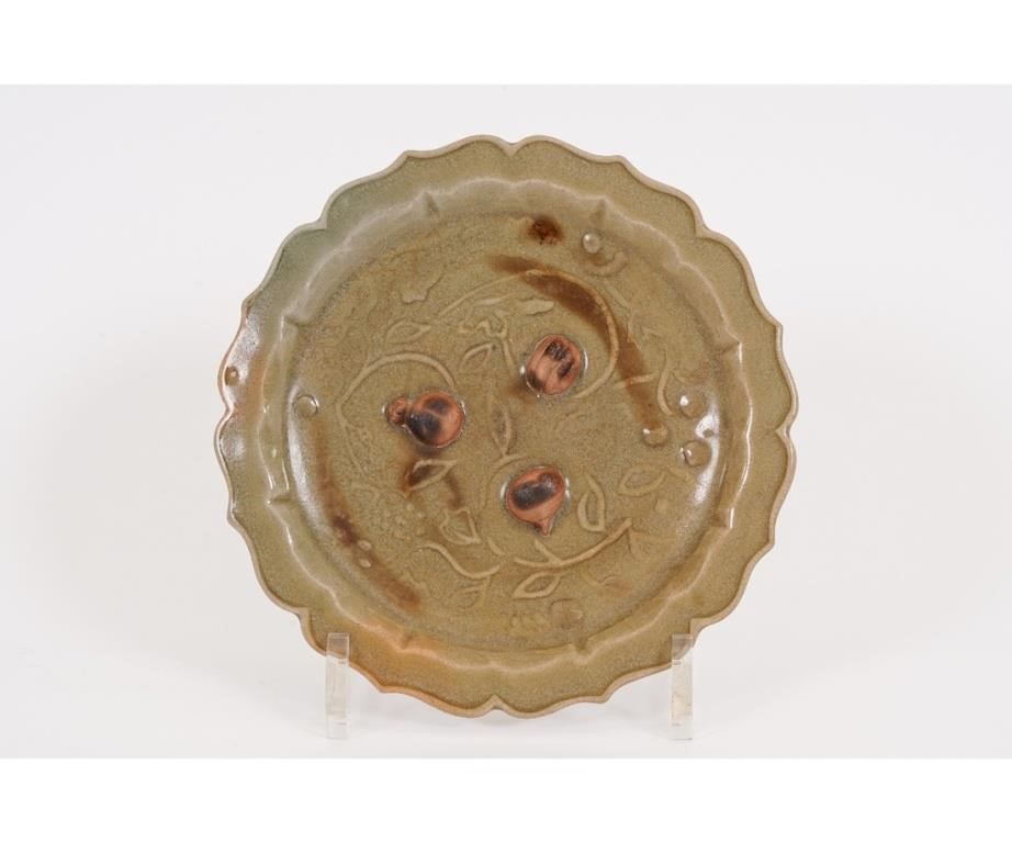 Appraisal: Chinese celadon glazed dish with raised relief fruit and scalloped