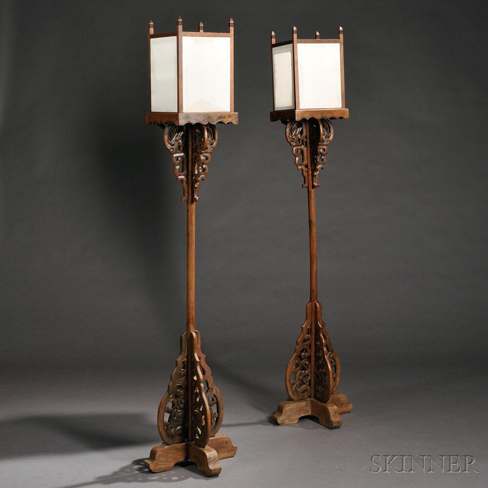 Appraisal: Pair of Lamp Stands China yumu candle stand set above