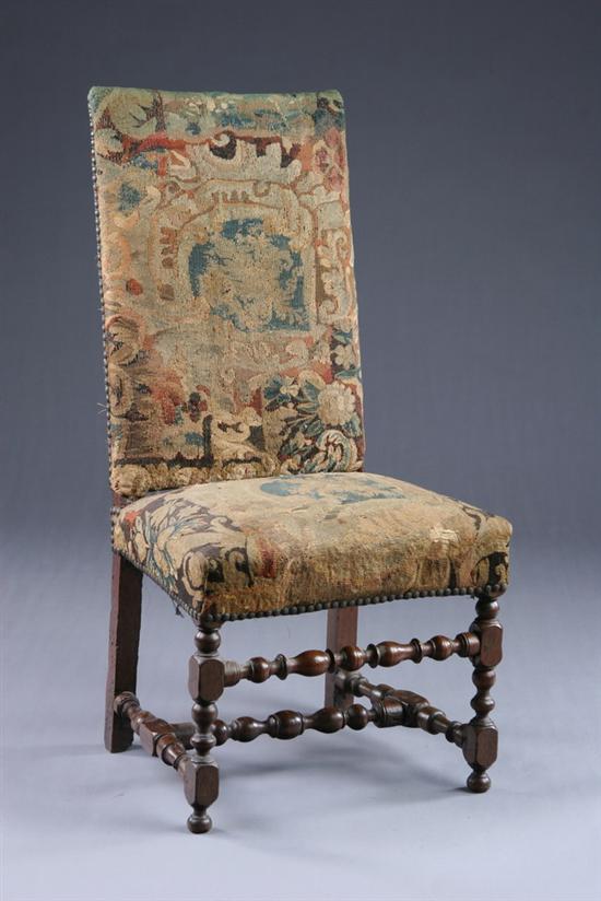 Appraisal: LOUIS XIII STYLE FRUITWOOD SIDE CHAIR th century with nailed