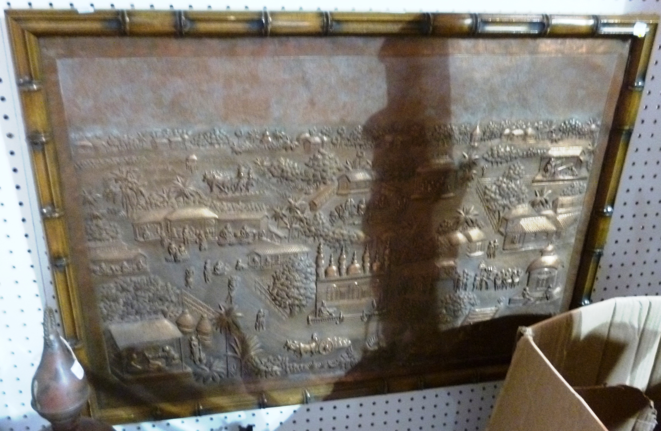 Appraisal: An embossed copper picture of an Eastern village in a