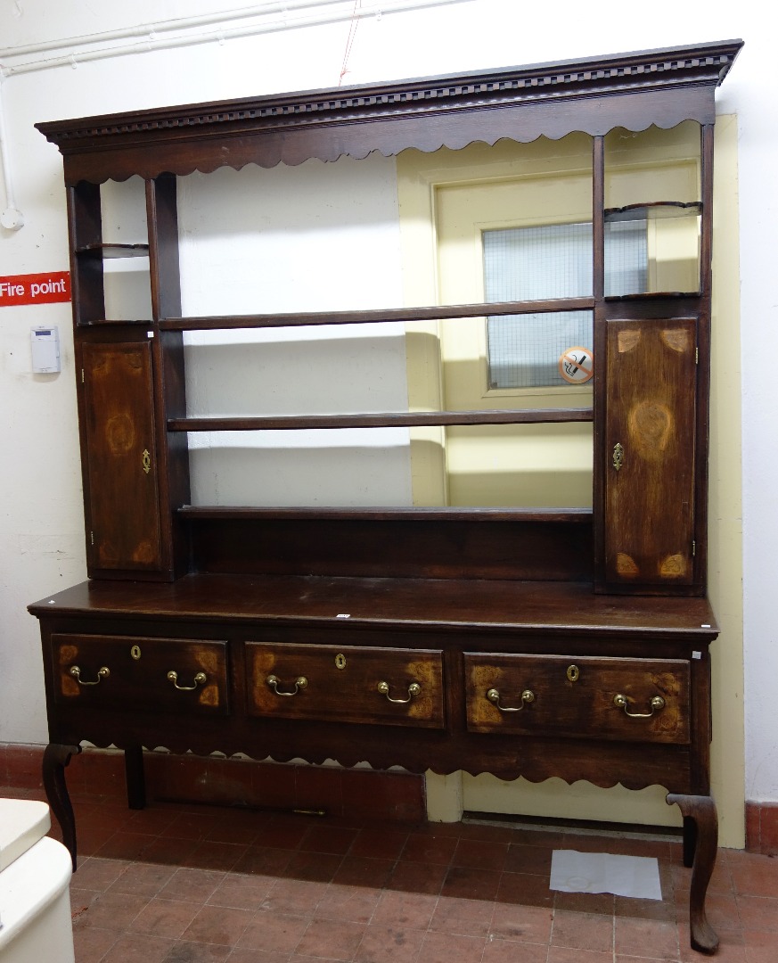 Appraisal: An th century oak dresser the three tier open plate