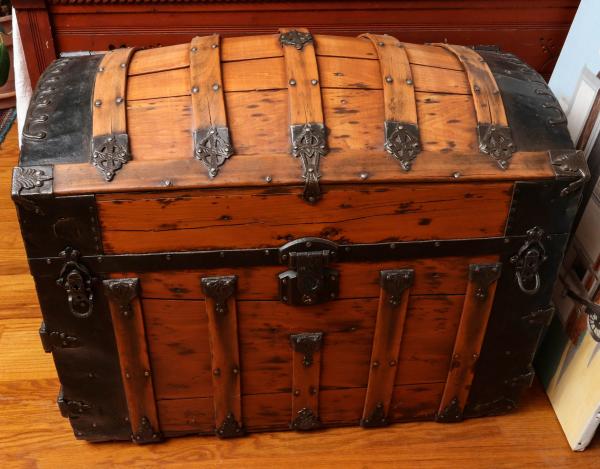 Appraisal: A TH C 'HUMP BACK' TRAVEL TRUNKThe example with exposed