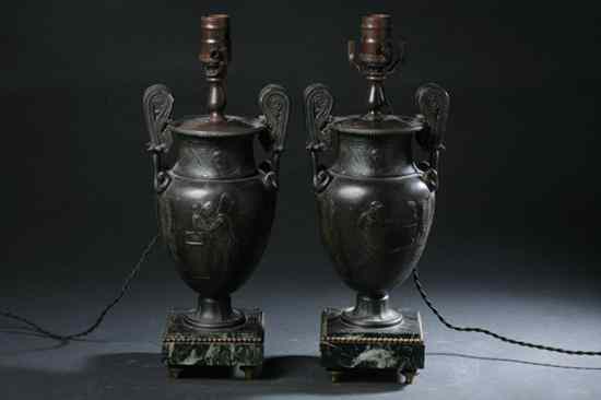 Appraisal: PAIR FRENCH EMPIRE-STYLE PATINATED METAL URNS early th century Modelled