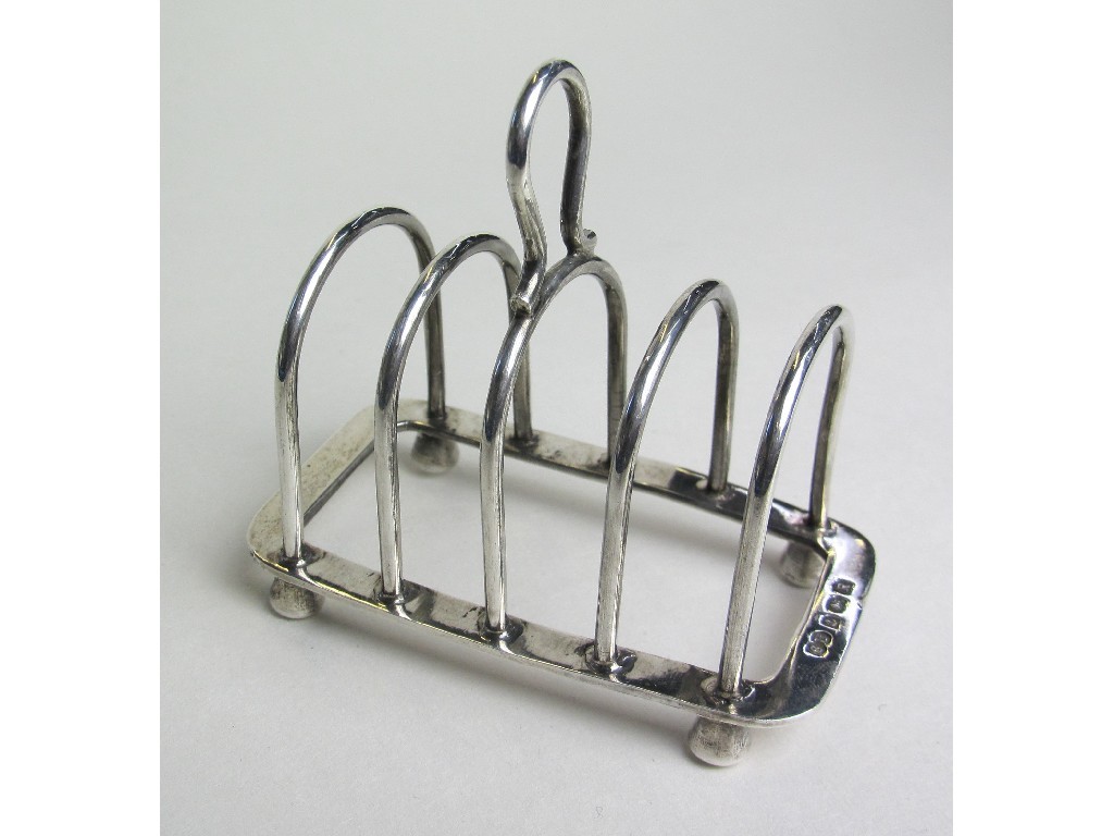 Appraisal: George V miniature silver toast rack by William Suckling Birmingham