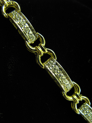 Appraisal: DIAMOND AND FOURTEEN KARAT GOLD BRACELET with alternating bar and