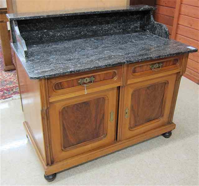 Appraisal: MARBLE-TOPPED WALNUT WASHSTAND German c having a rectangular gray black