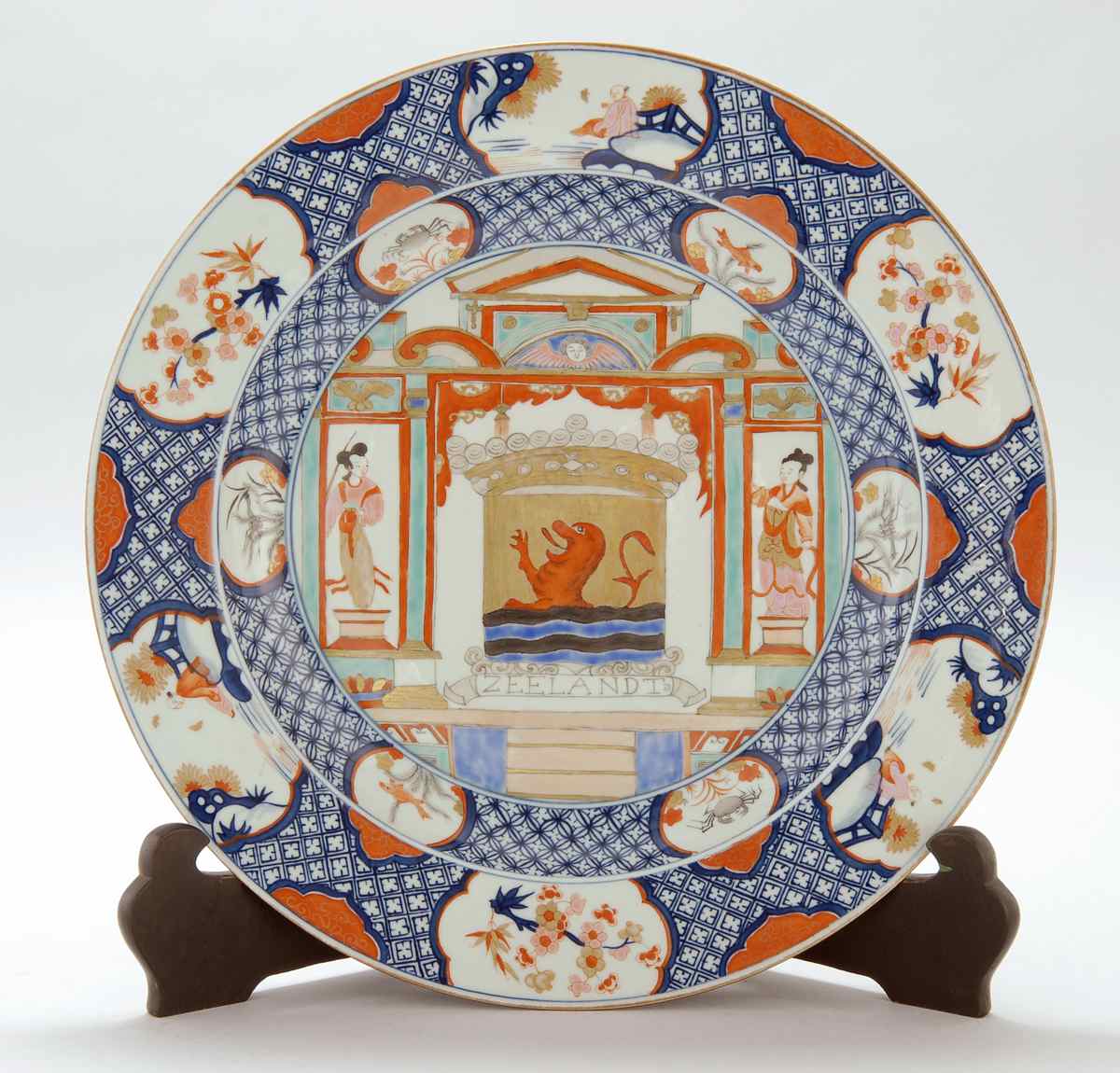 Appraisal: POLYCHROME PORCELAIN CHARGER With central gilt coat-of-arms flanked by a