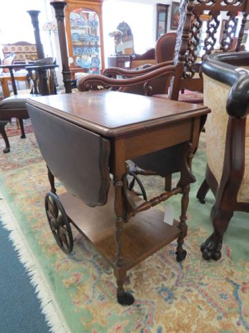 Appraisal: Mahogany Tea Cart deep sides and handle lower shelf