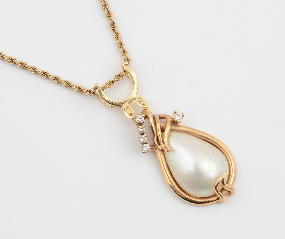 Appraisal: MABE PEARL DIAMOND PENDANT CHAIN K yellow gold pendant contains