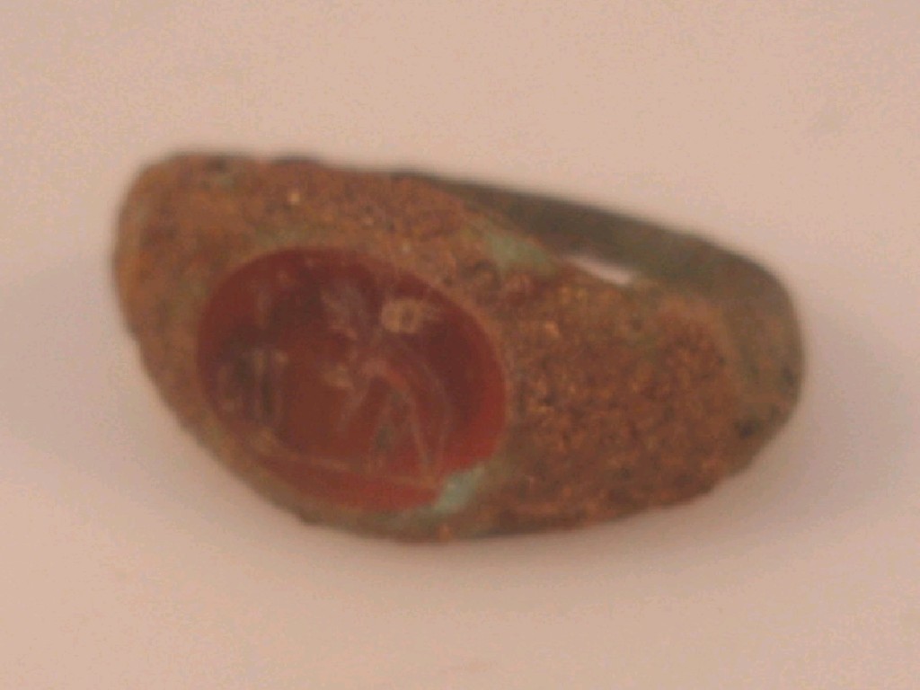 Appraisal: A Roman bronze ring set with an oval carnelian intaglio