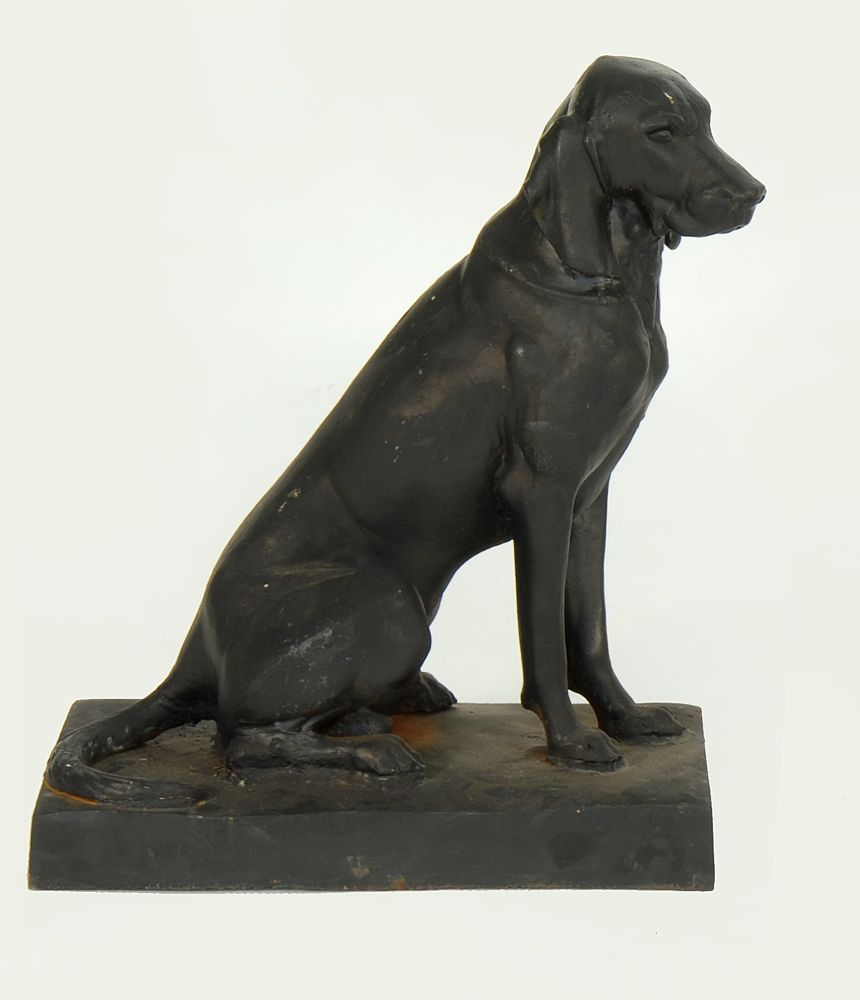 Appraisal: CAST IRON FIGURE Of a seated black Labrador retriever Height