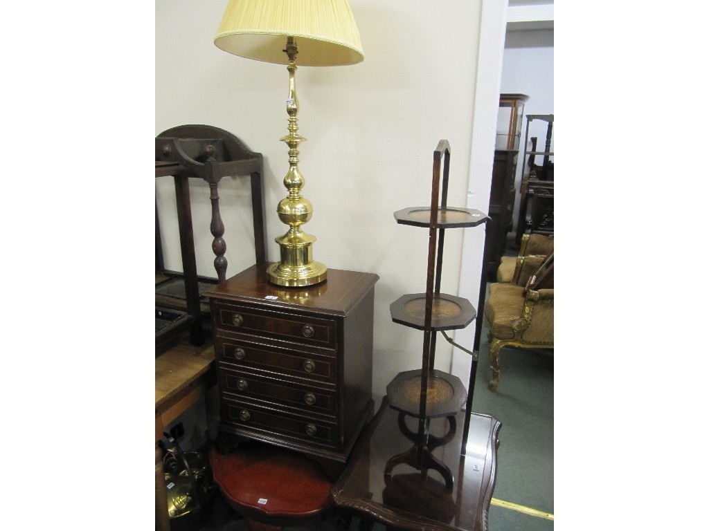 Appraisal: Nest of three tables folding cakestand chest of drawers coffee