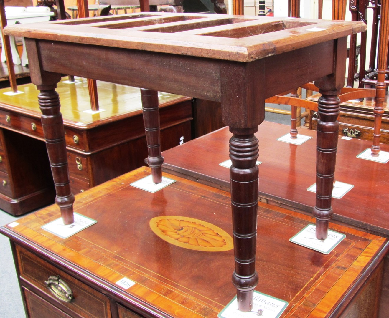 Appraisal: A late th century slatted walnut luggage stand on turned