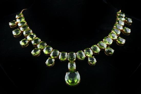 Appraisal: CUSTOM-MADE HIGH KARAT YELLOW GOLD AND PERIDOT CHOKER Flexible gold