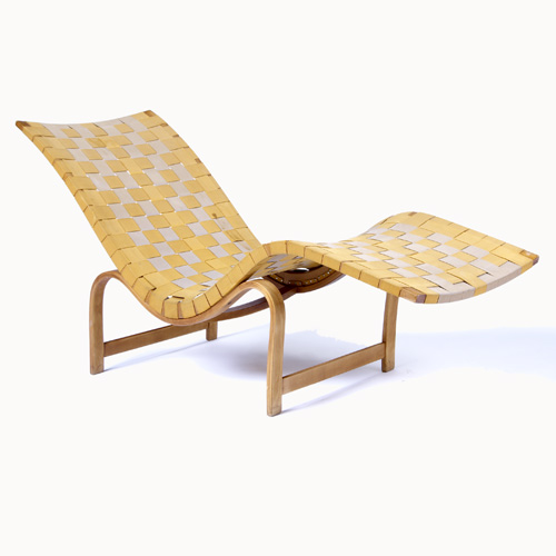 Appraisal: BRUNO MATHSSON Lounge chair with gold and umber webbing on