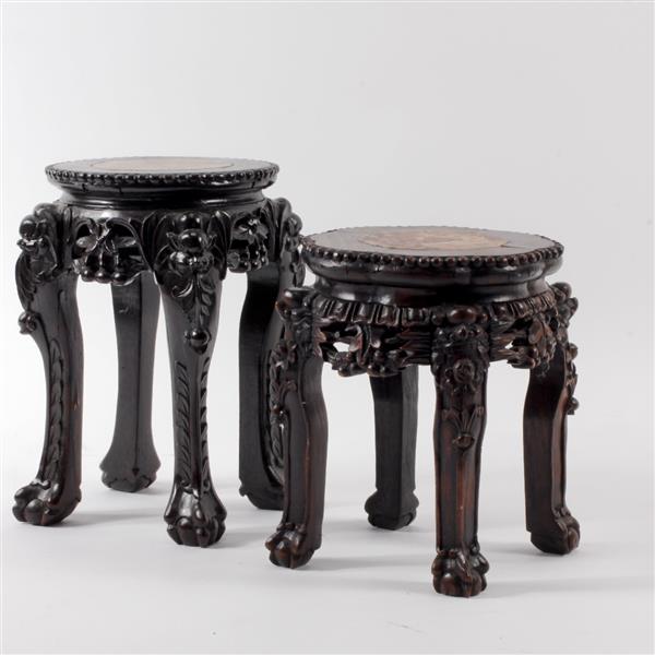 Appraisal: Two small Chinese carved black wood stands with marble top