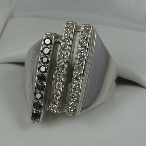 Appraisal: BLACK DIAMOND AND COLORLESS DIAMOND RING k white gold and