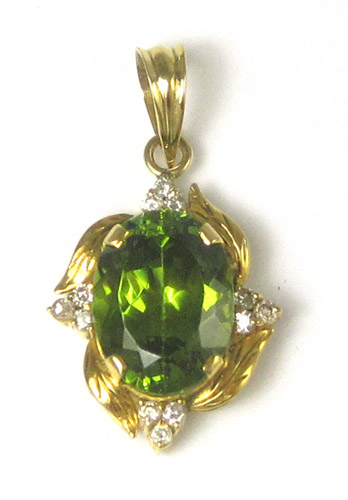 Appraisal: GREEN CUBIC ZIRCONIA AND DIAMOND PENDANT with twelve round-cut diamonds