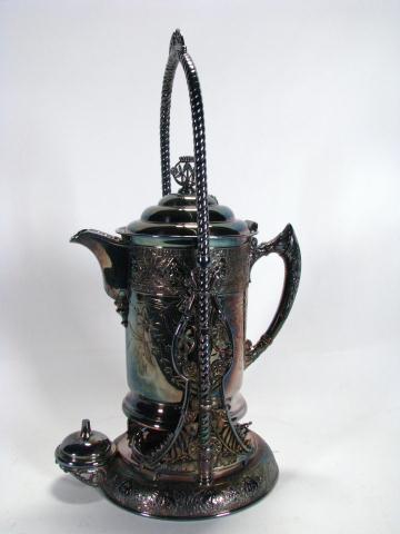 Appraisal: Antique silverplate hand-chased water server with stand marked Simpson Hall